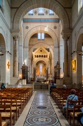 Altar;-Apse;-Axial-chapel;-Catholic-church;-Central-aisle;-Chandelier;-Choir;-Christianity;-Church-interior;-Column;-Kaleidos;-Kaleidos-images;-La-parole-à-limage;-Mosaic;-Mosaic-floor;-Nave;-Neo-Romanesque;-Places-of-worship;-Polychrome-frieze;-Religion;-Religious-architecture;-Religious-building;-Saint-Pierre-de-Montrouge-church;-Stories-Pictures;-Tarek-Charara;-Vault;-Visitor;-Wooden-chair